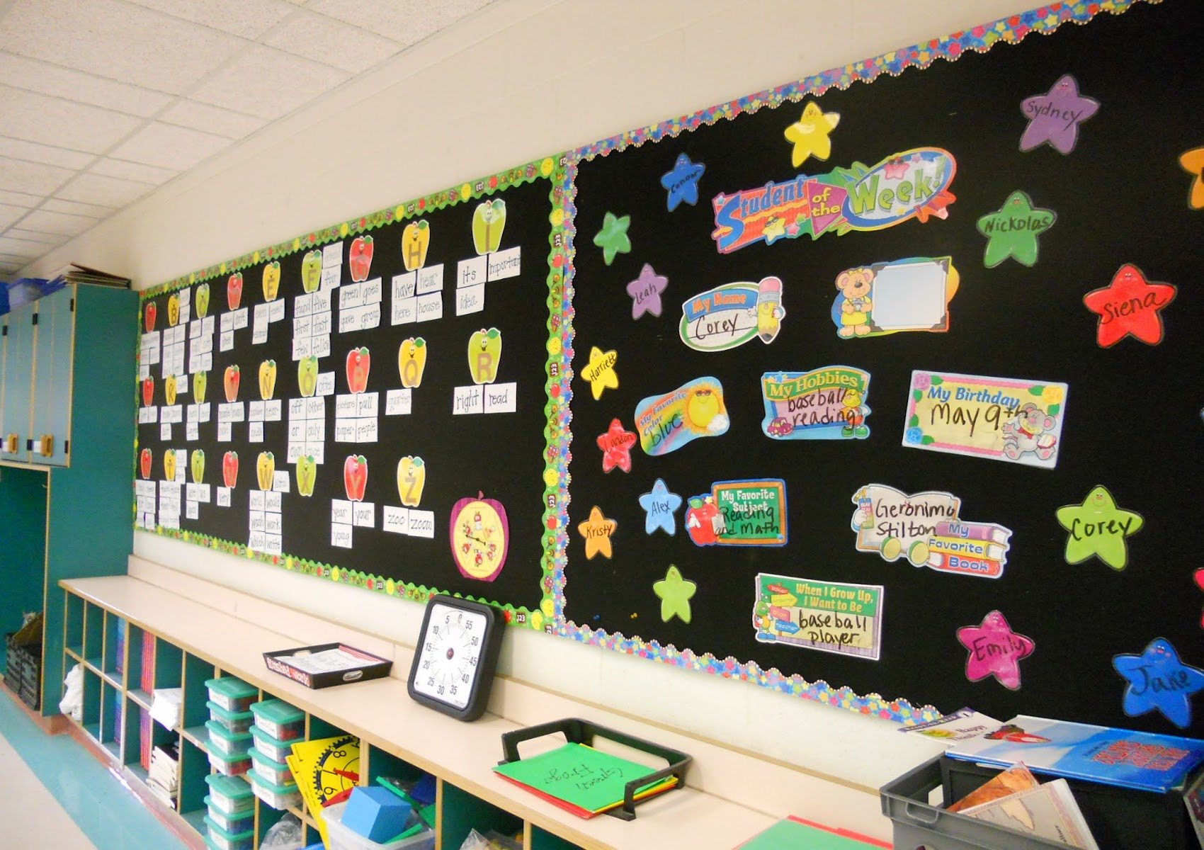 Classroom wall covered in Tempo display fabric with student materials attached